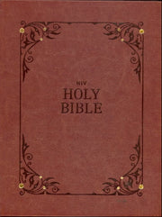 Brown leather-bound Bible with decorative corners and gold rivets