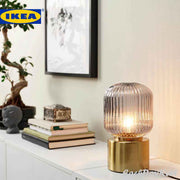 SOLKLINT Table lamp, brass/grey clear glass - IKEA - EachDayKart